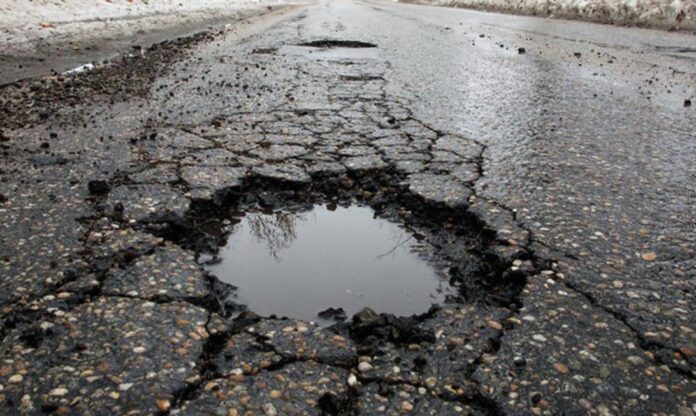 How To Fix Small Potholes And Cracks On Your Driveway - Green Poison