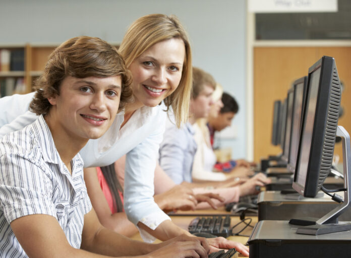 Students working on computers in library