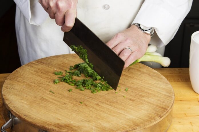 Asian Cuisine- using cleaver to chop vegetables