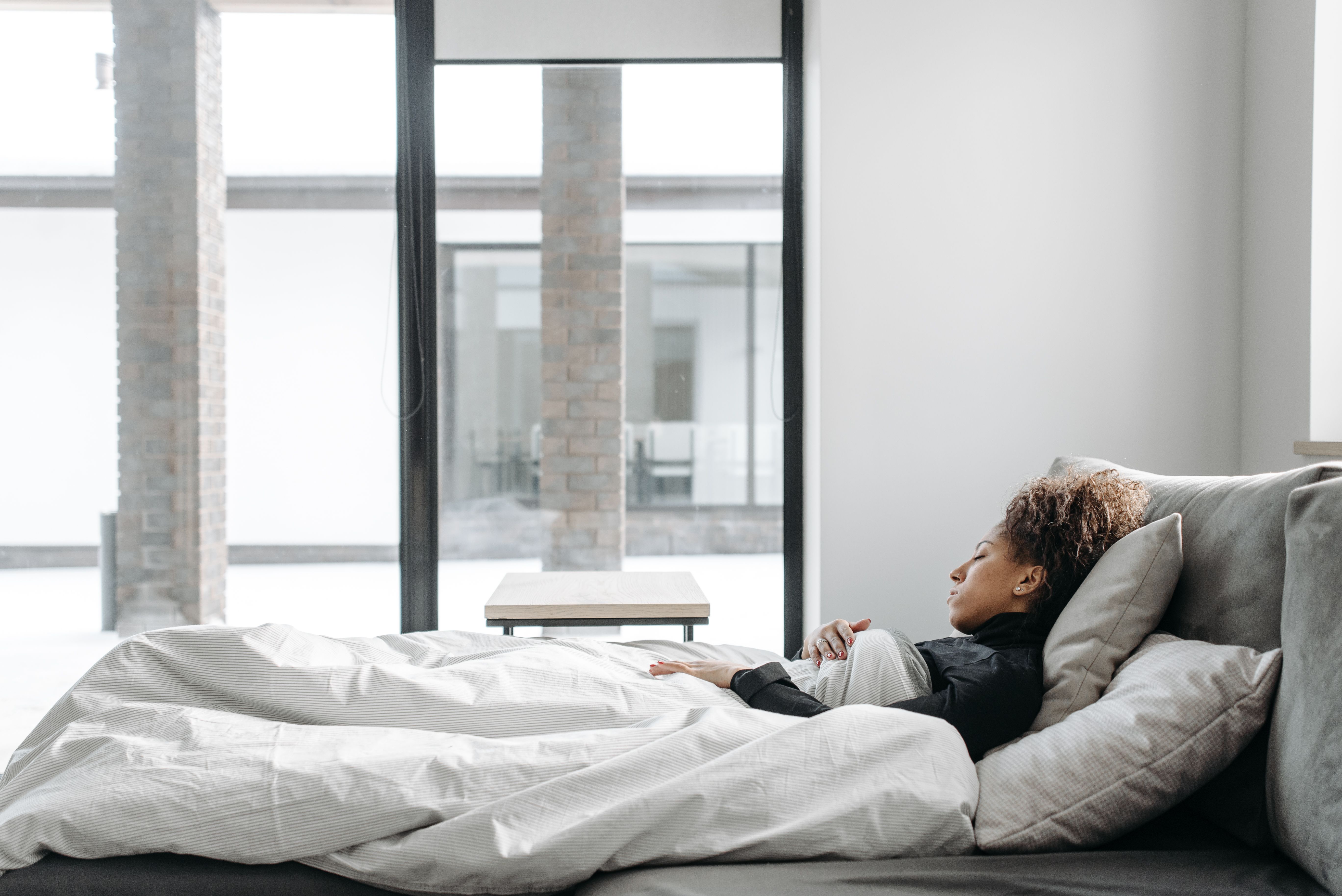 Woman resting comfortably at home during the final stage of recovery