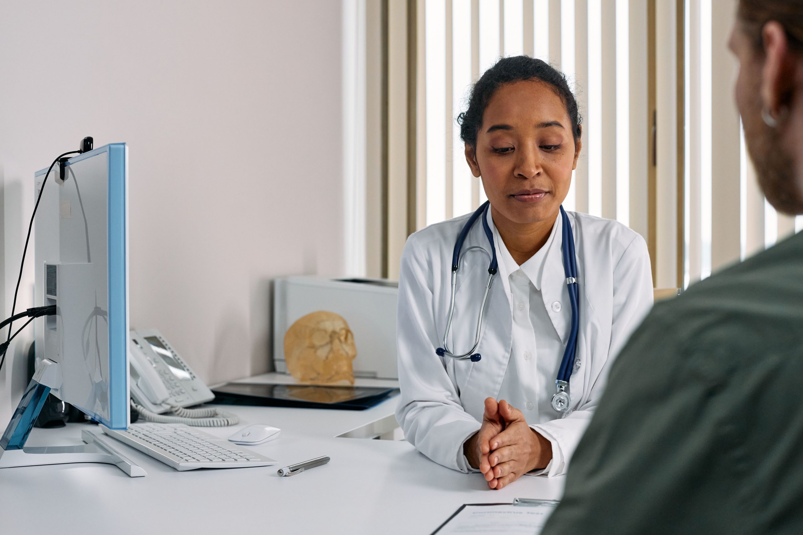 Doctor consulting with a patient during an initial medical consultation
